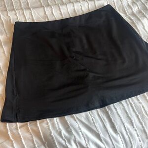 Women’s black tennis golf skort.